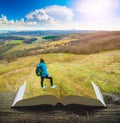 Girl hiker on the pages of book Royalty Free Stock Photo