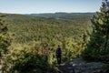 Girl hiking in the Forest near lake in La Mauricie National Park Quebec, Canada on a beautiful day Royalty Free Stock Photo