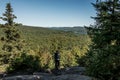 Girl hiking in the Forest near lake in La Mauricie National Park Quebec, Canada on a beautiful day Royalty Free Stock Photo