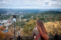 The girl on the hill looks at the autumn Lviv