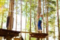 Girl on hinged trail in extreme rope Park Royalty Free Stock Photo