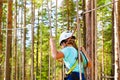 Girl on hinged trail in extreme rope Park Royalty Free Stock Photo