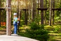 Girl on hinged trail in extreme rope Park Royalty Free Stock Photo