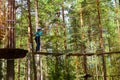 Girl on hinged trail in extreme rope Park Royalty Free Stock Photo