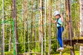 Girl on hinged trail in extreme rope Park Royalty Free Stock Photo