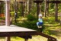 Girl on hinged trail in extreme rope Park Royalty Free Stock Photo