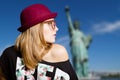 Girl in hipster glasses and hat on New York