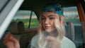 Girl hipster sitting car wearing bandana closeup. Woman posing retro automobile Royalty Free Stock Photo