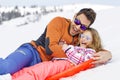 Girl and his father sledding very fast