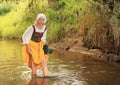 Girl in historical dress in water