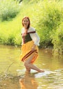 Girl in historical dress in water