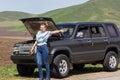 Girl hitches a car Royalty Free Stock Photo