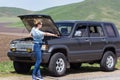 Girl hitches a car Royalty Free Stock Photo