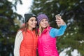 Girl Hold Smart Phone Camera Taking Selfie Photo Snow Forest Young Woman Couple Outdoor Winter Royalty Free Stock Photo