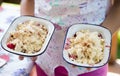 Girl holding apple and blackberry compote crumble Royalty Free Stock Photo