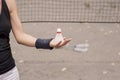 Girl holding a badminton shuttlecock Royalty Free Stock Photo