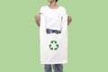 Girl is holding bag canvas fabric with recycle symbol isolated