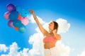 Girl holding balloons sky background Royalty Free Stock Photo