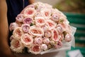 Girl holding a beautiful bouquet of pastel color rose peonies Royalty Free Stock Photo