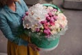 Girl holding beautiful mix white and pink flower bouquet in round box with lid Royalty Free Stock Photo