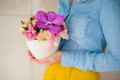 Girl holding beautiful pink bouquet of mixed flowers in vase Royalty Free Stock Photo