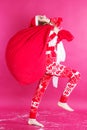 Girl is holding big red christmas bag Royalty Free Stock Photo