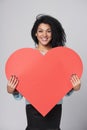 Girl holding big red heart shape Royalty Free Stock Photo