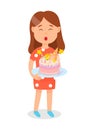 Girl Holding Birthday Cake Blowing out Candles.
