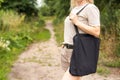 Girl is holding black cotton eco tote bag, design mockup Royalty Free Stock Photo