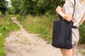 Girl is holding black cotton eco tote bag, design mockup Royalty Free Stock Photo