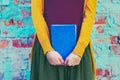 Girl holding book in hands Royalty Free Stock Photo