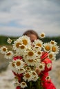 Girl holding bouquet of daisy flowers Royalty Free Stock Photo