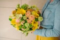 Girl holding Bouquet of the different mixed orange flowers Royalty Free Stock Photo