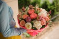 Girl holding Bouquet of the different mixed orange and white flowers Royalty Free Stock Photo