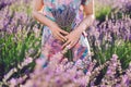 Girl Holding Bouquet on Lavender Field