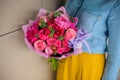 Girl holding bouquet of a mixed pink and purple flowers Royalty Free Stock Photo