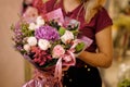 Girl holding a bouquet of roses, astilba and berries Royalty Free Stock Photo