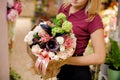 Girl holding a bouquet of roses, callas, orchid and hydrangea Royalty Free Stock Photo