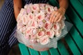 Girl holding bouquet of tender pastel color rose peonies Royalty Free Stock Photo