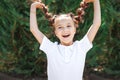 Girl holding braids