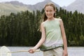 Girl Holding Butterfly Net By Lake Royalty Free Stock Photo