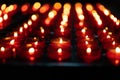 A girl is holding candle and praying near altar in church. Royalty Free Stock Photo