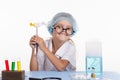 Girl holding a chemist tweezers candy