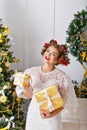 Girl holding Christmas gifts. Royalty Free Stock Photo