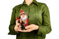 Girl holding a christmas santa figurine