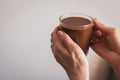 Girl holding coffee cup. Hands holding cup of morning coffee. Latte in cafe. Cappuccino cup. Espresso with milk. Hot drinks. Royalty Free Stock Photo