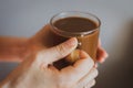 Girl holding coffee cup. Hands holding cup of morning coffee. Latte in cafe. Cappuccino cup. Espresso with milk. Hot drinks. Royalty Free Stock Photo