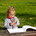 Girl holding colored pencils in her hands Royalty Free Stock Photo