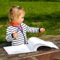 Girl holding colored pencils in her hands Royalty Free Stock Photo