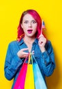 Girl holding a colored shopping bags and USA flag Royalty Free Stock Photo